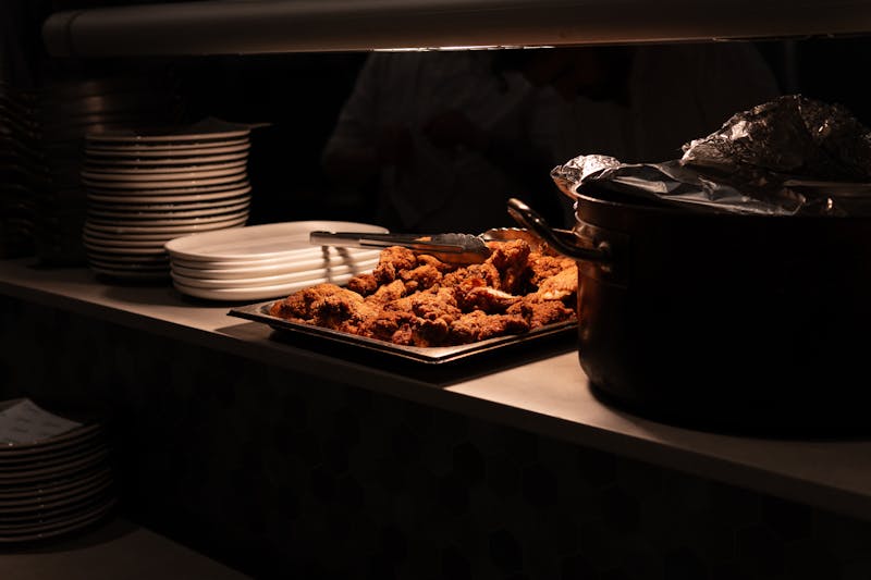 Community gathering event with food spread on outdoor tables